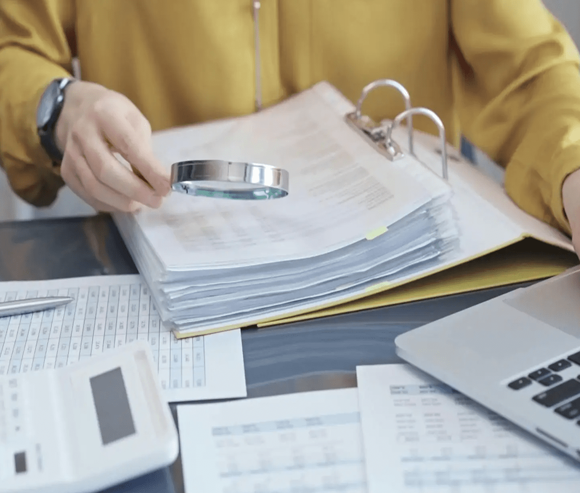 Analyzing paperwork on desk